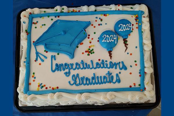 Cake with Congratulations 2024 PhD Graduates decoration