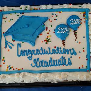 Cake with Congratulations 2024 PhD Graduates decoration