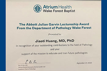Atrium Health Award Certificate for Dr. Jiaoti Huang