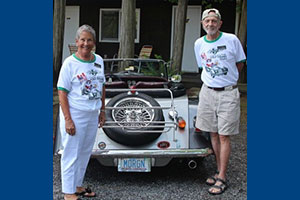 Dr. Patrick Buckley (right) with his wife, Judy, with their Morgan British roadster