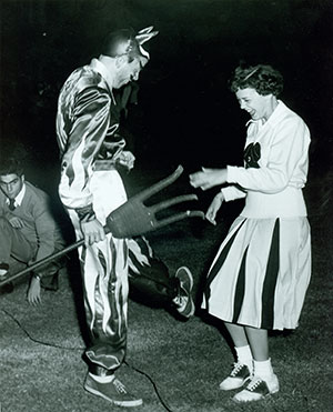 Jack Craver Evans in 1952 in Blue Devil mascot costume with cheerleader