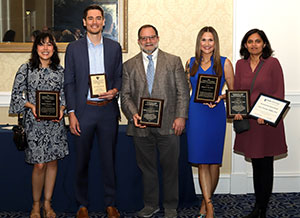Left to right: Drs. Natalya Ramirez, Tyler Wildes, Nicholas Bandarenko, Meg Lee, and Avani Pendse, with their awards