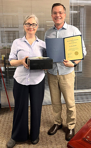 Dr. Anne Buckley (left) with Dr. Matthew Schiederjan, TDAC Neuropathology Chair Dr. Matthew Schiederjan (Right)
