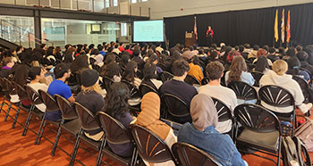 Dr. Andrea Deyrup speaks to a packed house