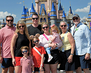Mr. Conlon’s children, grandchildren, and wife celebrating his retirement at Disney World in April 2025