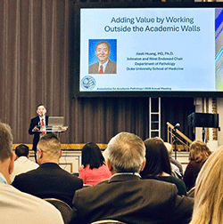 Dr. Jiaoti Huang presenting at AAPath