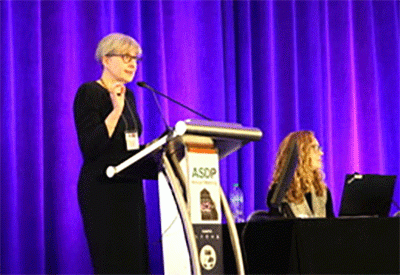 Dr. Angelica Selim presenting at podium