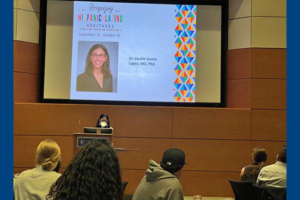 Giselle Lopez, MD, PhD, presenting at gala