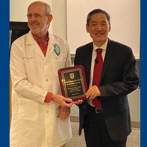 Brian G. Rowan, PhD, Chair, Department of Structural & Cellular Biology at Tulane University, and Jiaoti Huang, MD, PhD