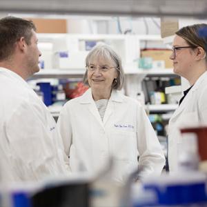 Dr. Virginia Byers Kraus speaking with colleagues